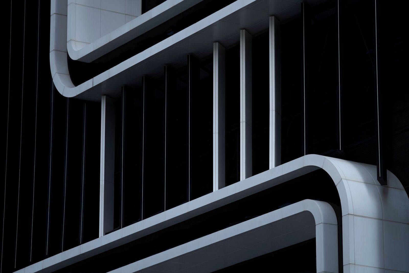 White architectural lines against a dark facade